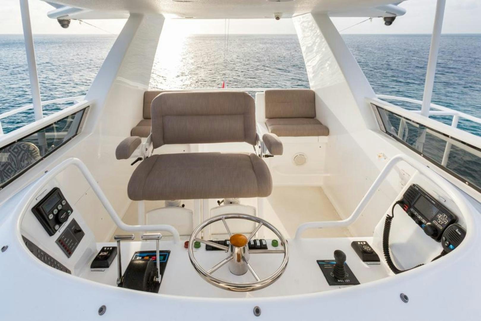 a boat with seats and a steering wheel on the front aboard PIRATE RADIO Yacht for Sale