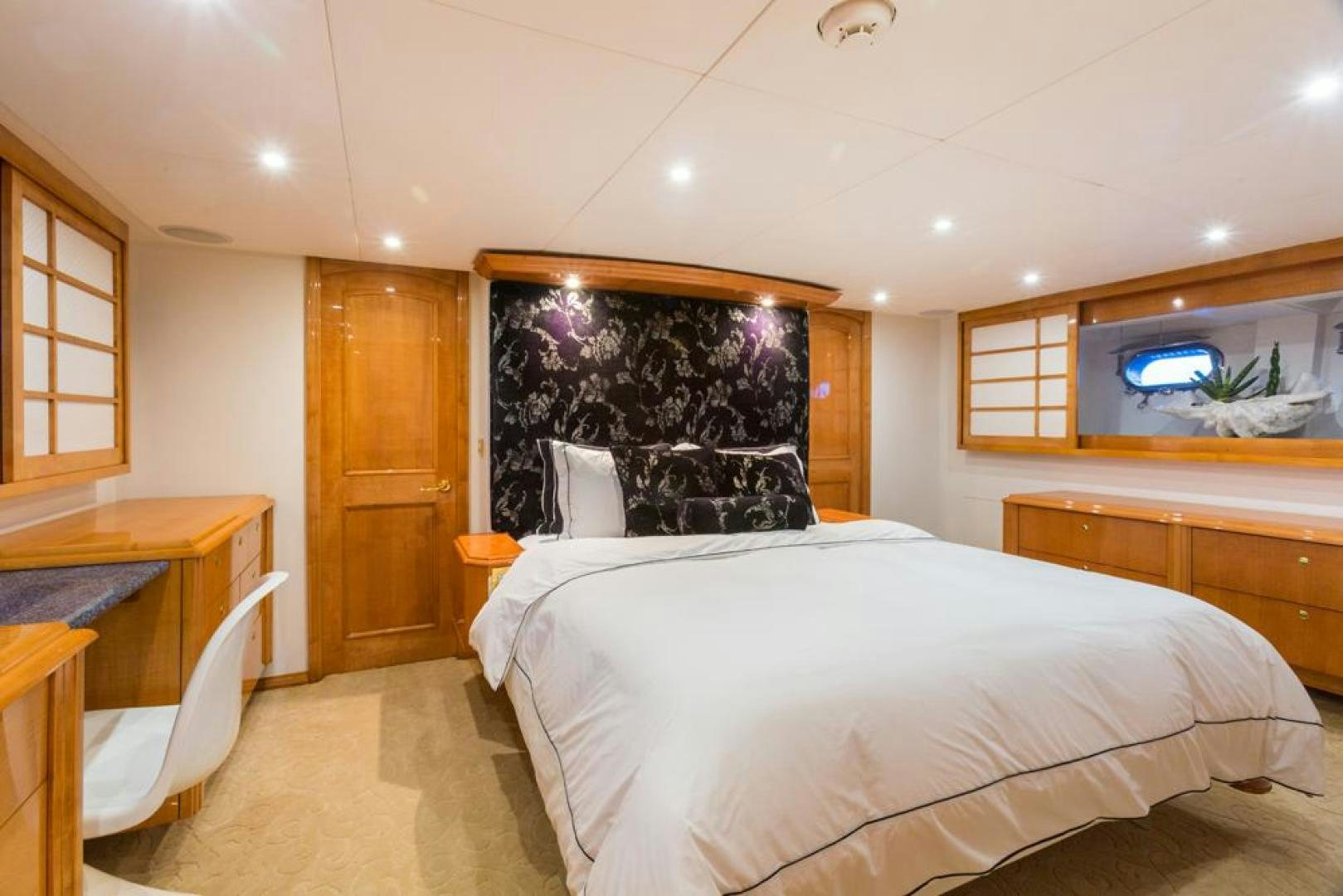 a room with a bed and a television aboard PIRATE RADIO Yacht for Sale