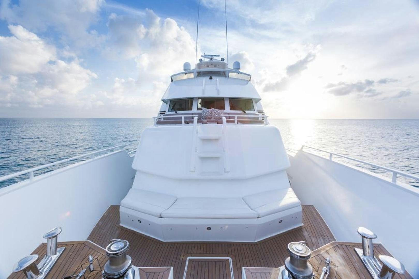 a white boat on a deck aboard PIRATE RADIO Yacht for Sale