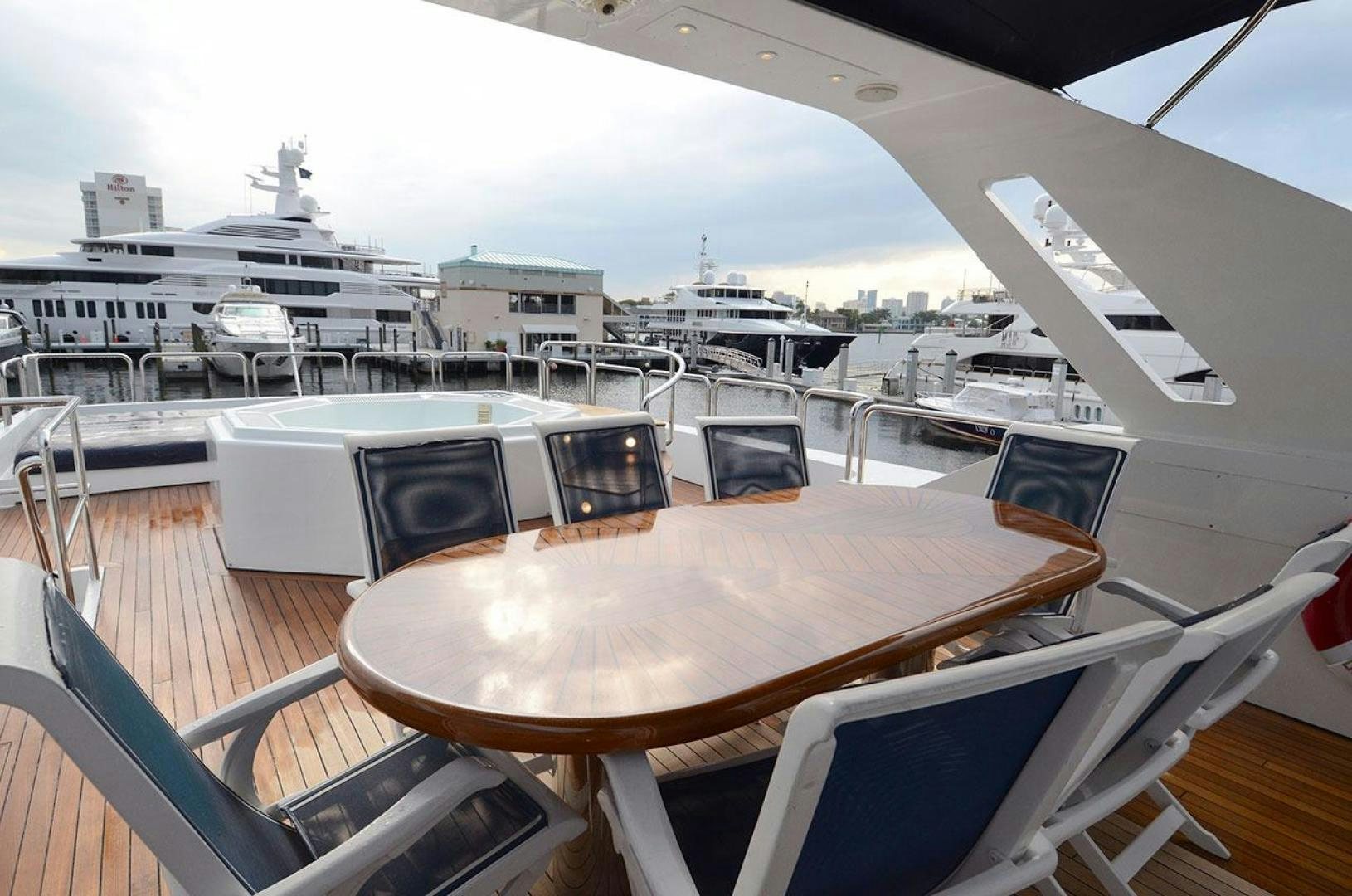 a table with chairs on it aboard LADY ARLENE Yacht for Sale