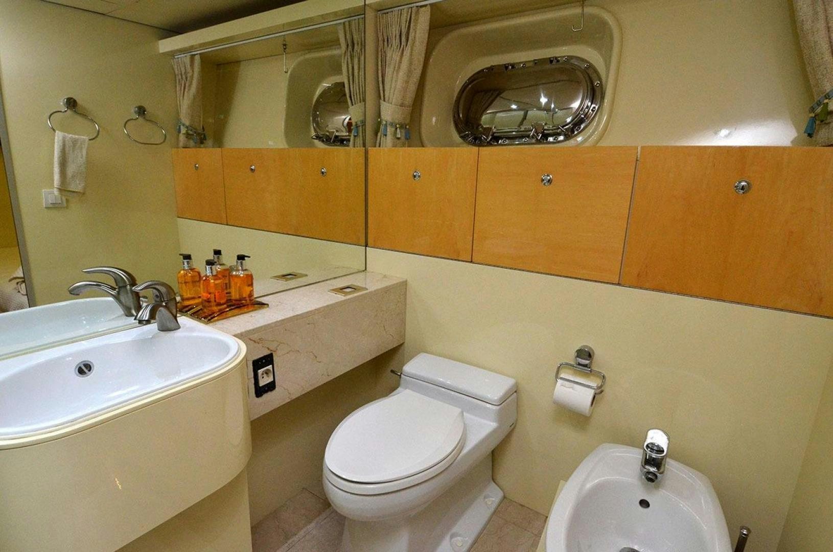 a bathroom with orange cabinets aboard LADY ARLENE Yacht for Sale