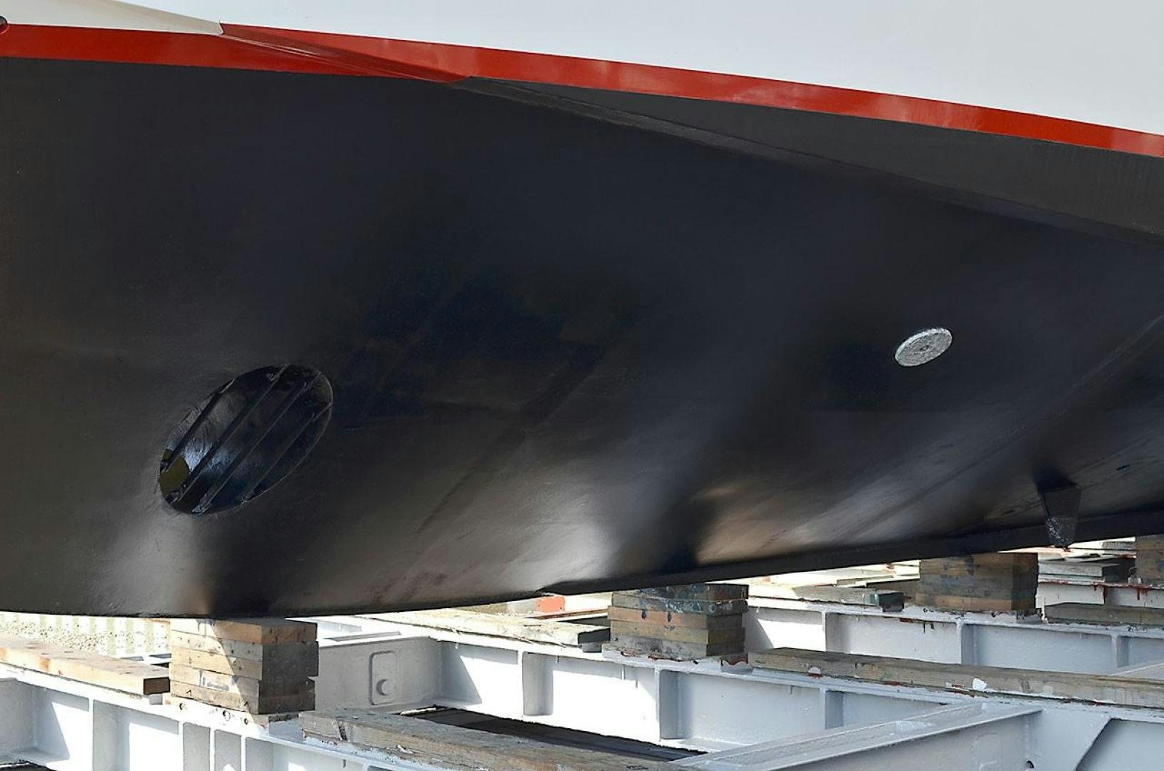 a black car with a red stripe aboard LADY ARLENE Yacht for Sale
