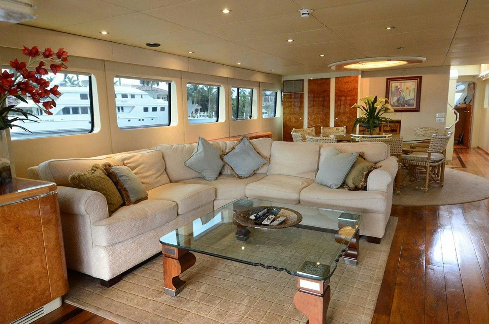 a living room with a couch and coffee table aboard LADY ARLENE Yacht for Sale