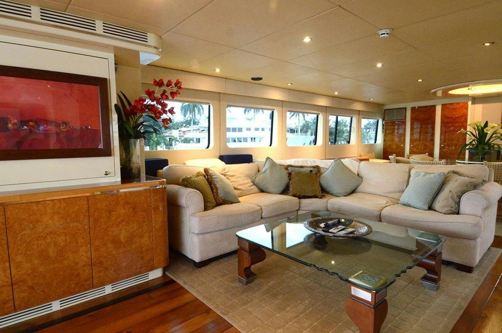 a living room with a large screen aboard LADY ARLENE Yacht for Sale