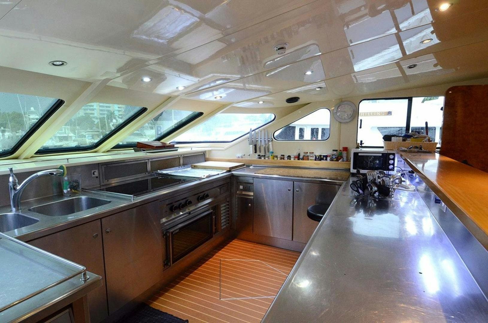 a kitchen with a large island aboard LADY ARLENE Yacht for Sale