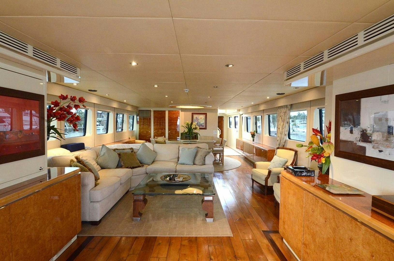 a living room with a large window aboard LADY ARLENE Yacht for Sale