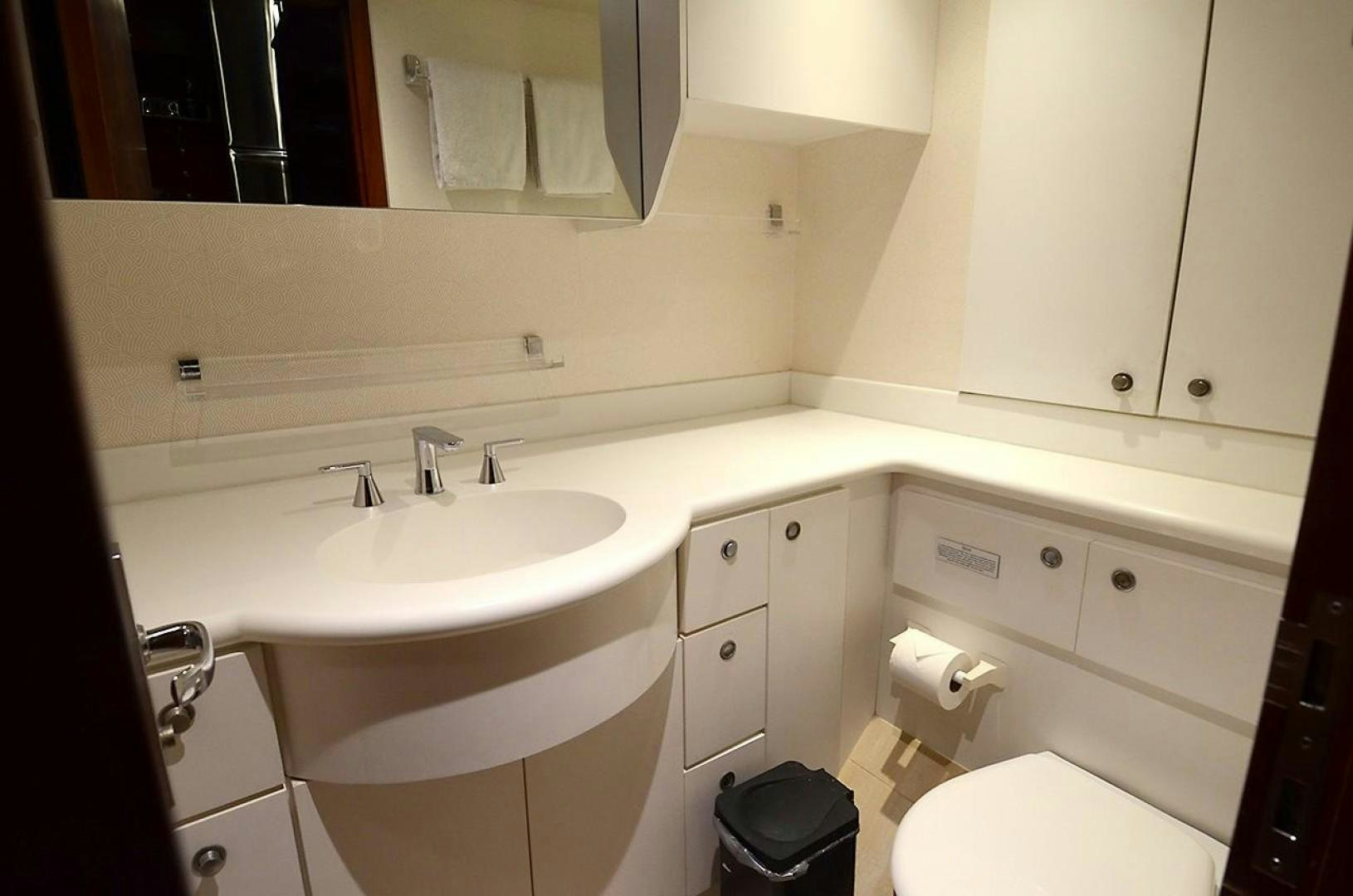 a bathroom with a sink and toilet aboard OUTTA TOUCH Yacht for Sale