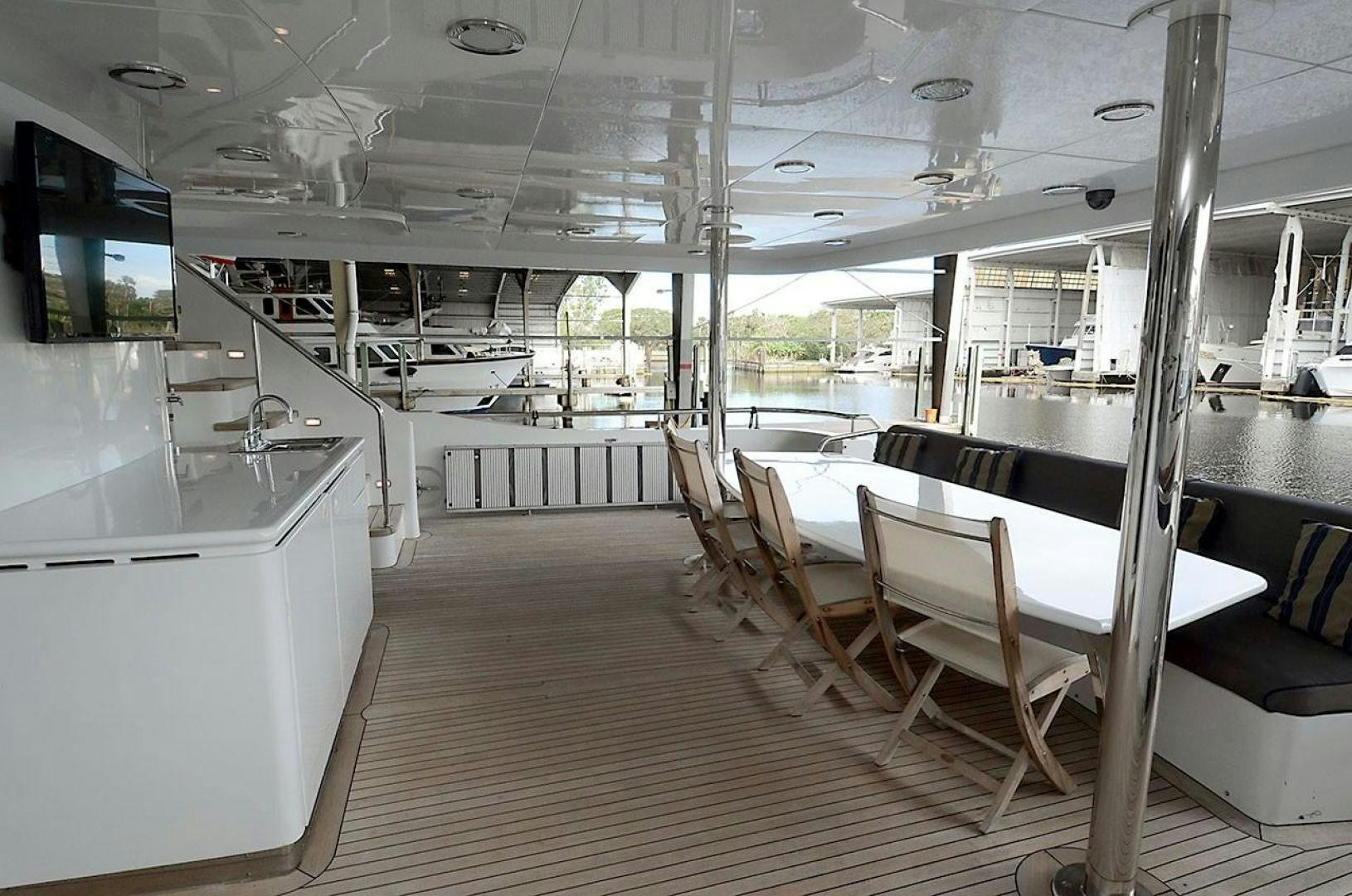 a room with tables and chairs aboard OUTTA TOUCH Yacht for Sale