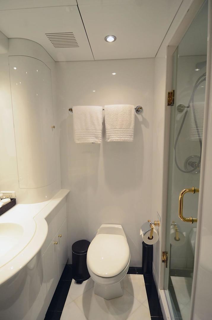 a bathroom with a toilet and sink aboard OUTTA TOUCH Yacht for Sale