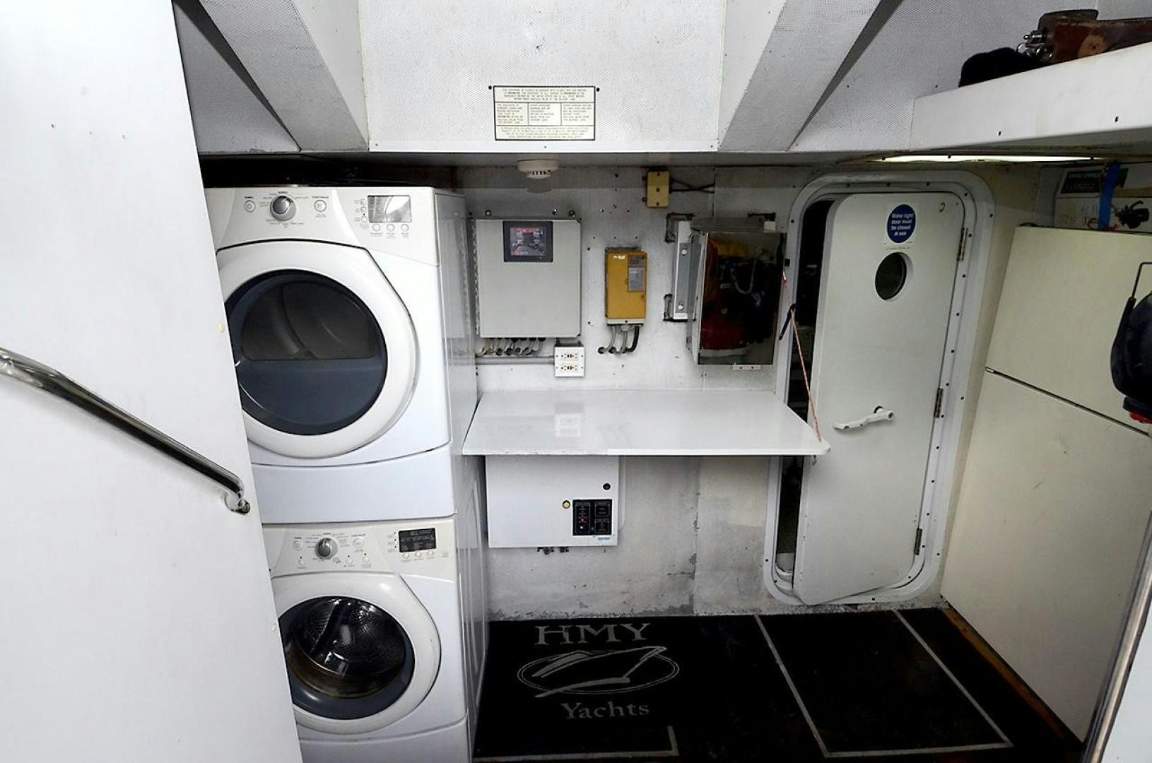 a white laundry room aboard OUTTA TOUCH Yacht for Sale