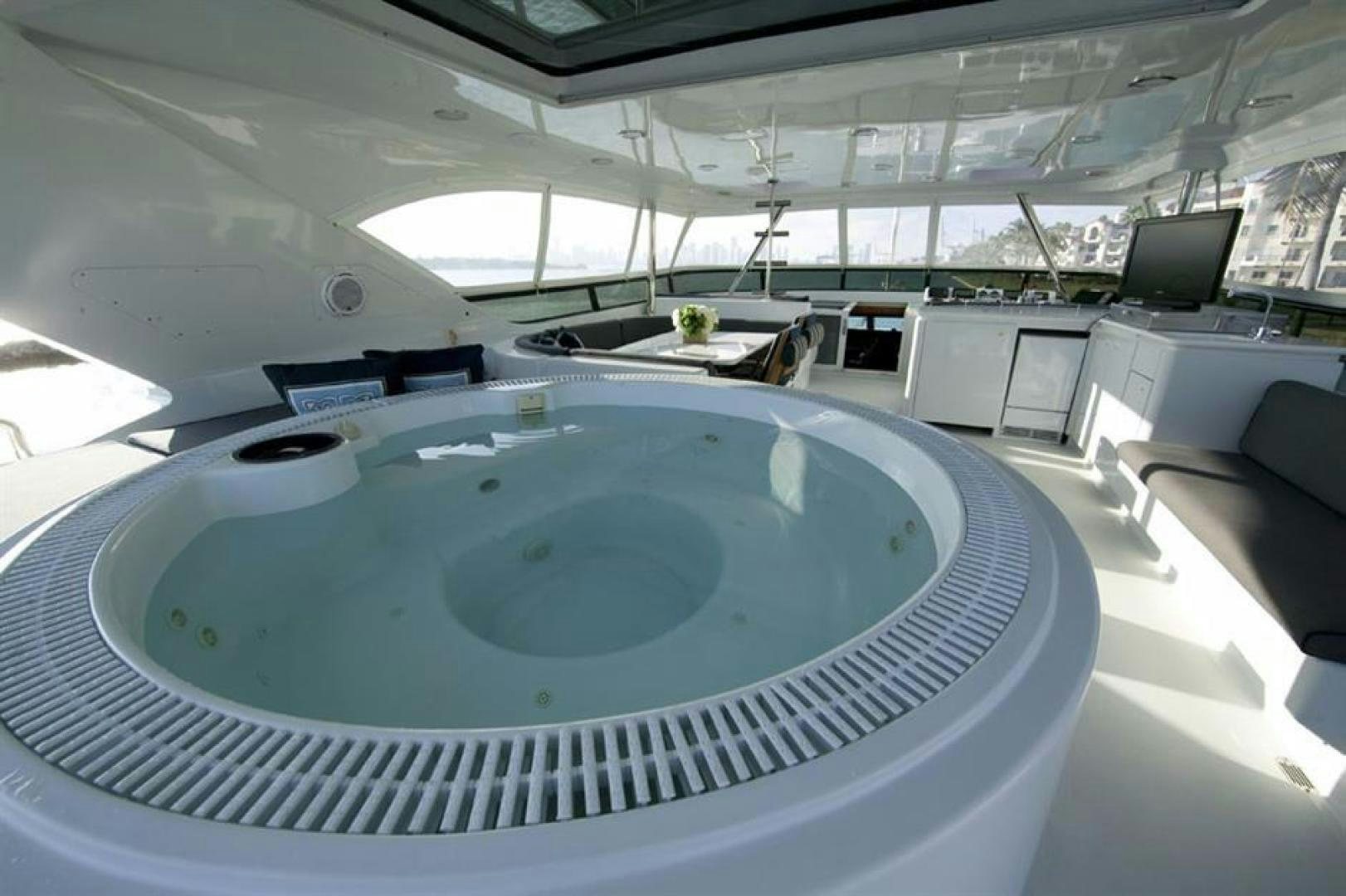 a large round blue ball in a room with a large glass ceiling aboard OUTTA TOUCH Yacht for Sale