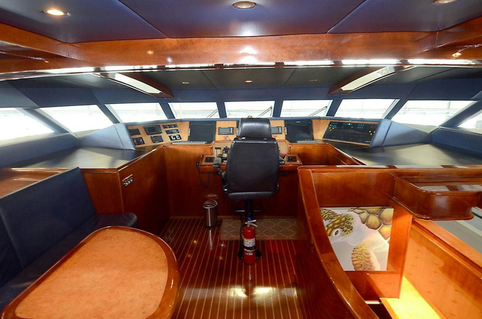 a room with seats and a table aboard OUTTA TOUCH Yacht for Sale