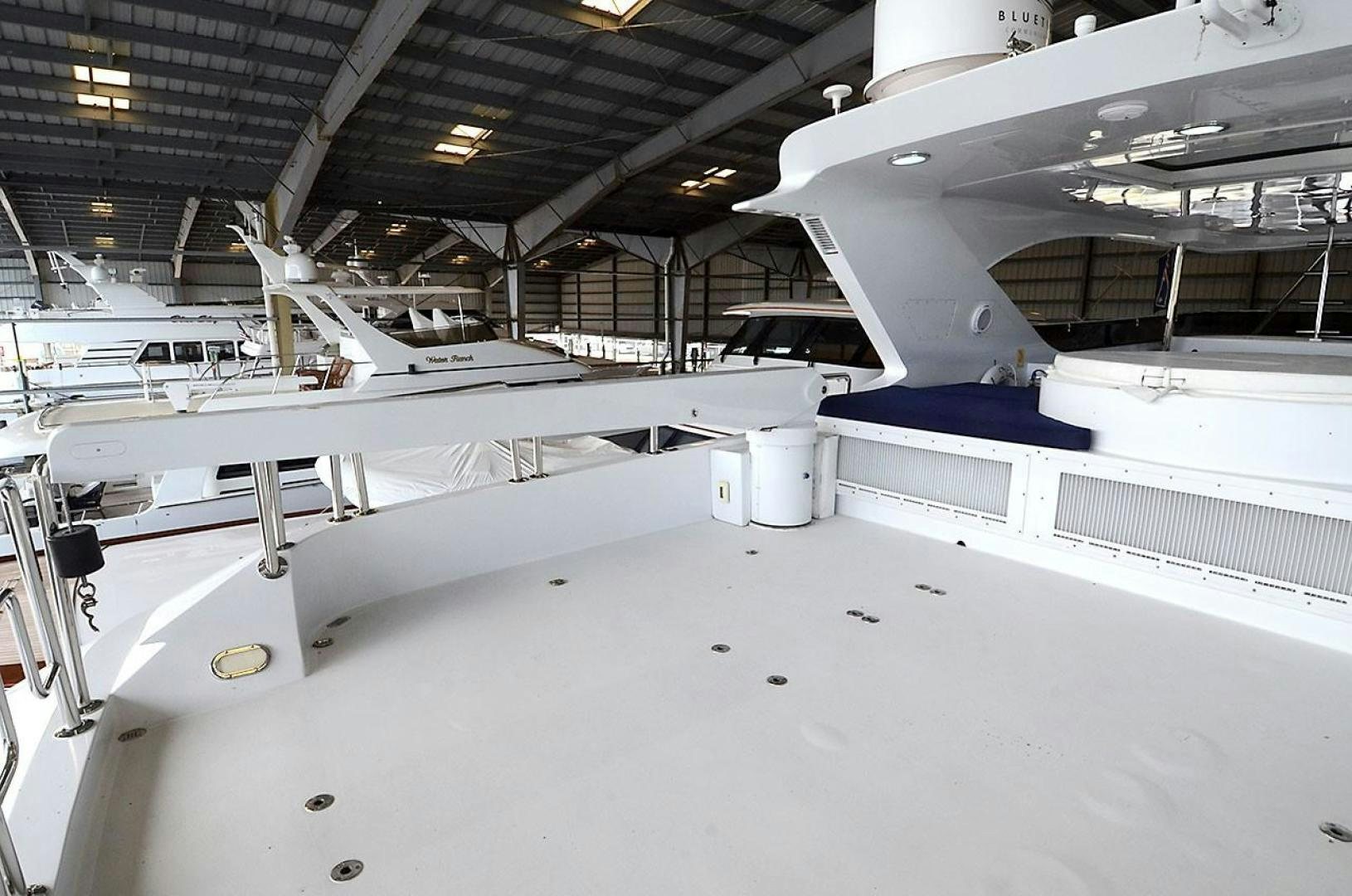 a large white airplane in a hangar aboard OUTTA TOUCH Yacht for Sale
