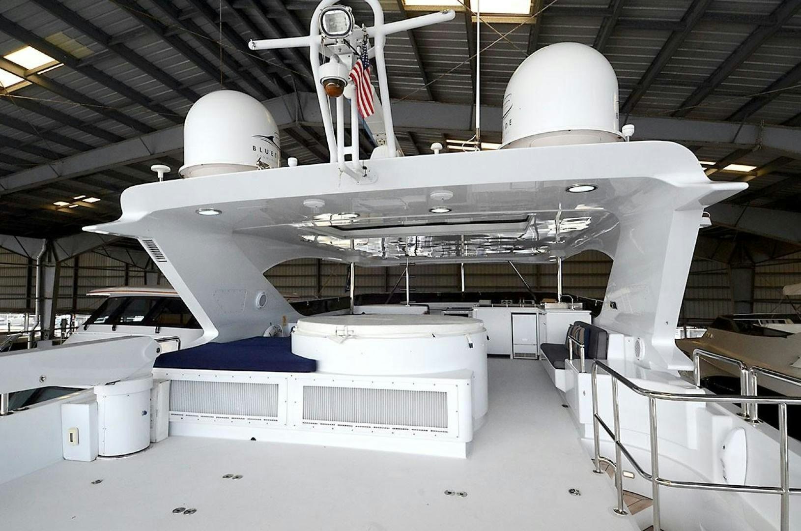 a large white aircraft in a hangar aboard OUTTA TOUCH Yacht for Sale