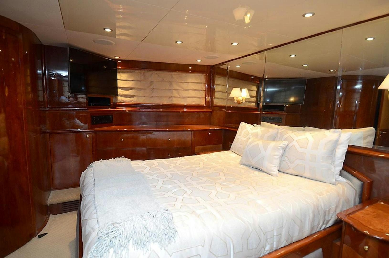 a bed with white sheets aboard OUTTA TOUCH Yacht for Sale
