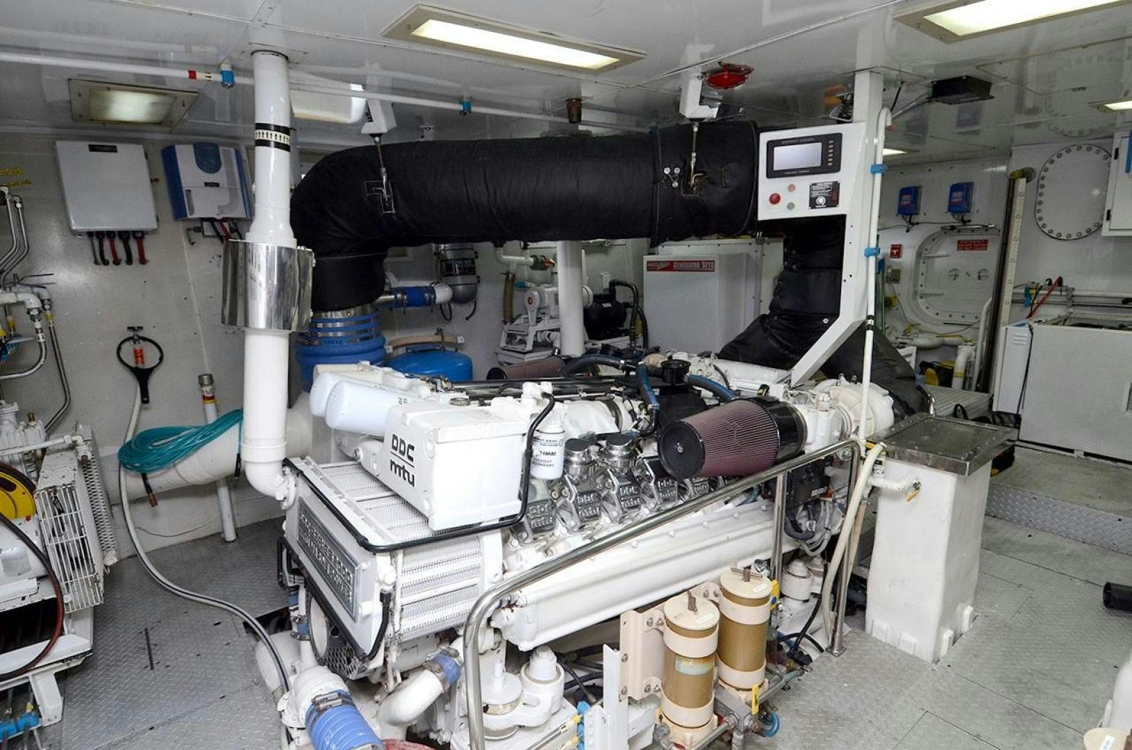 a room with machinery and pipes aboard OUTTA TOUCH Yacht for Sale