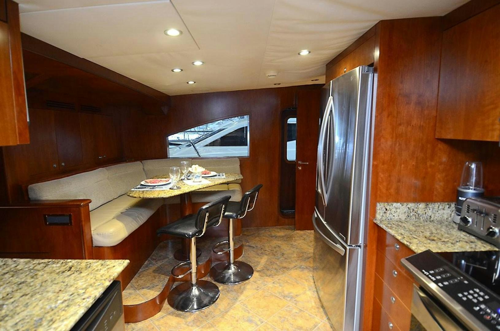a kitchen with a stainless steel refrigerator aboard OUTTA TOUCH Yacht for Sale