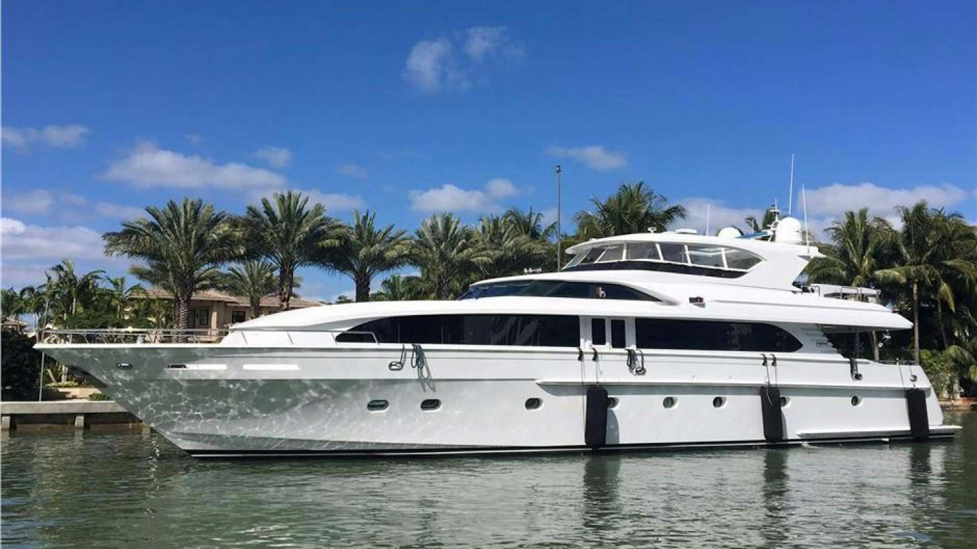 a white yacht in the water aboard OUTTA TOUCH Yacht for Sale
