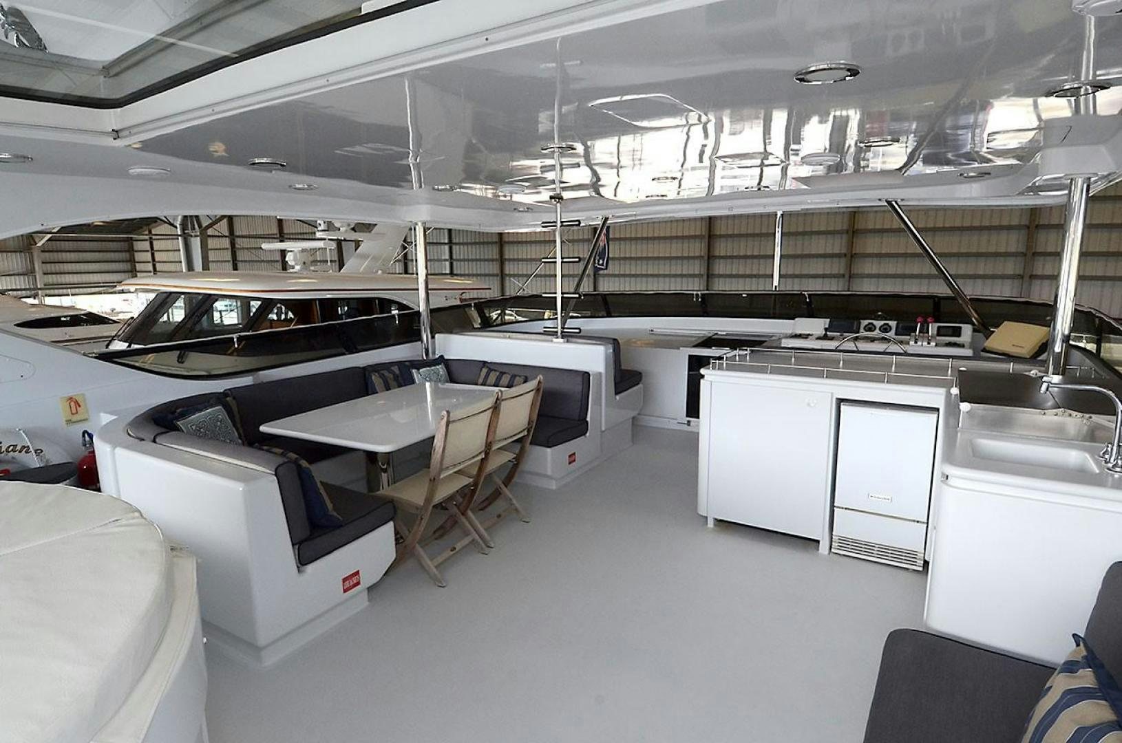 a room with tables and chairs aboard OUTTA TOUCH Yacht for Sale