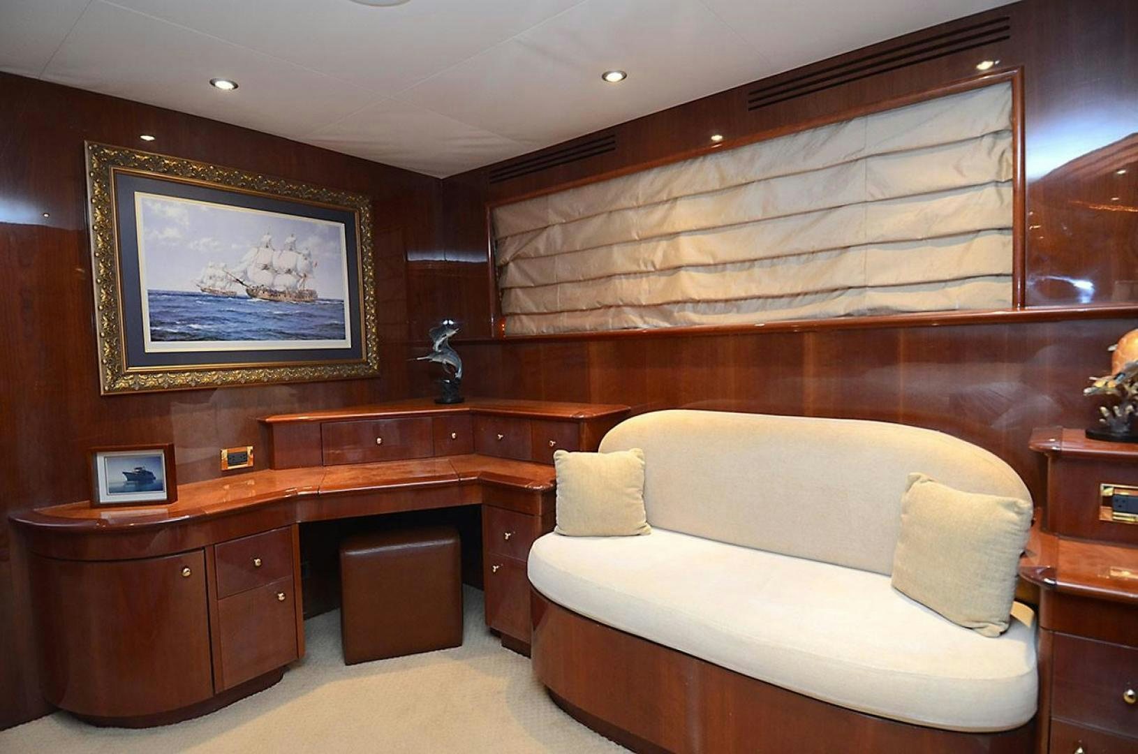 a room with a bed and a painting on the wall aboard OUTTA TOUCH Yacht for Sale