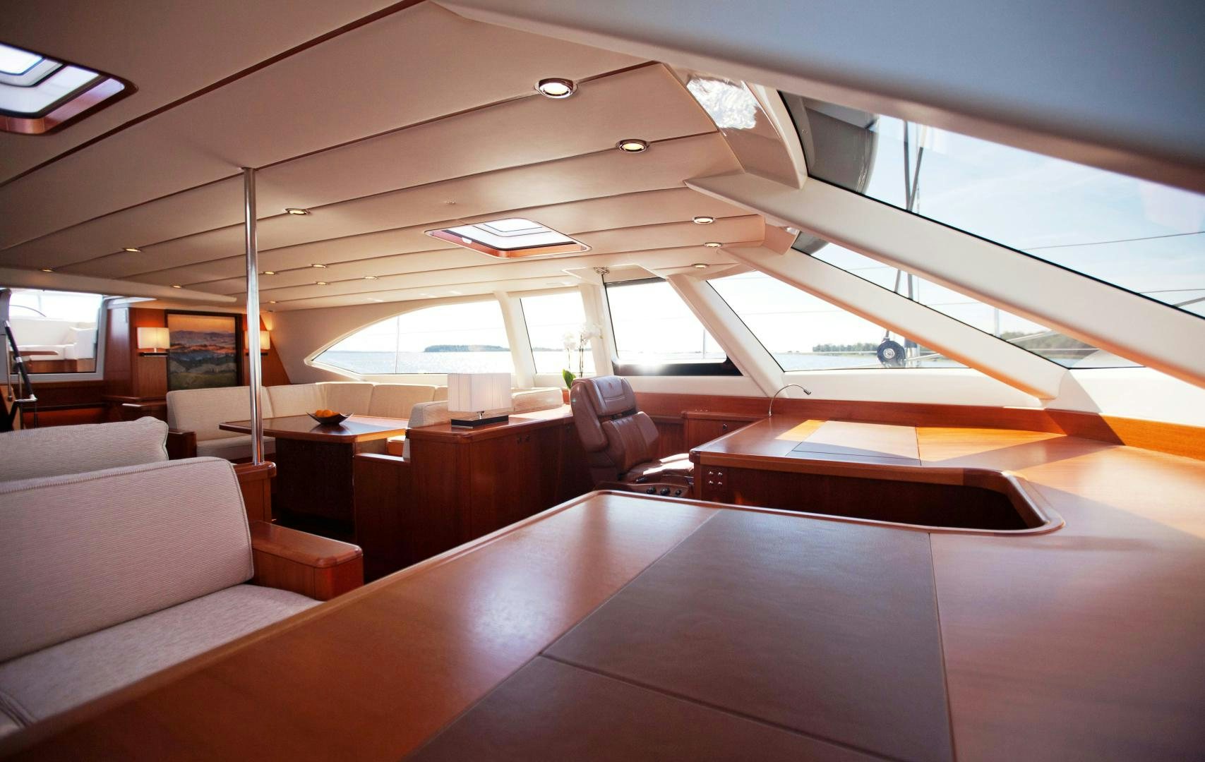 a room with couches and a table aboard CHILD OF LIR  Yacht for Sale