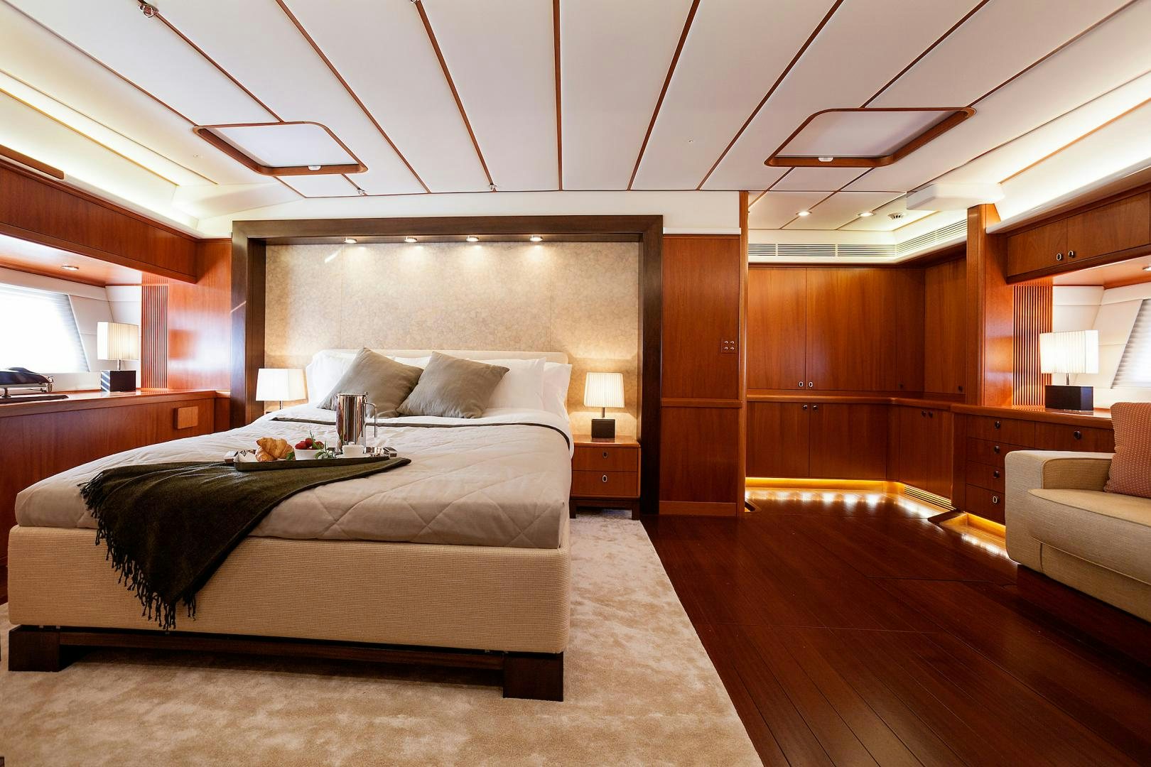 a room with a bed and a couch aboard CHILD OF LIR  Yacht for Sale