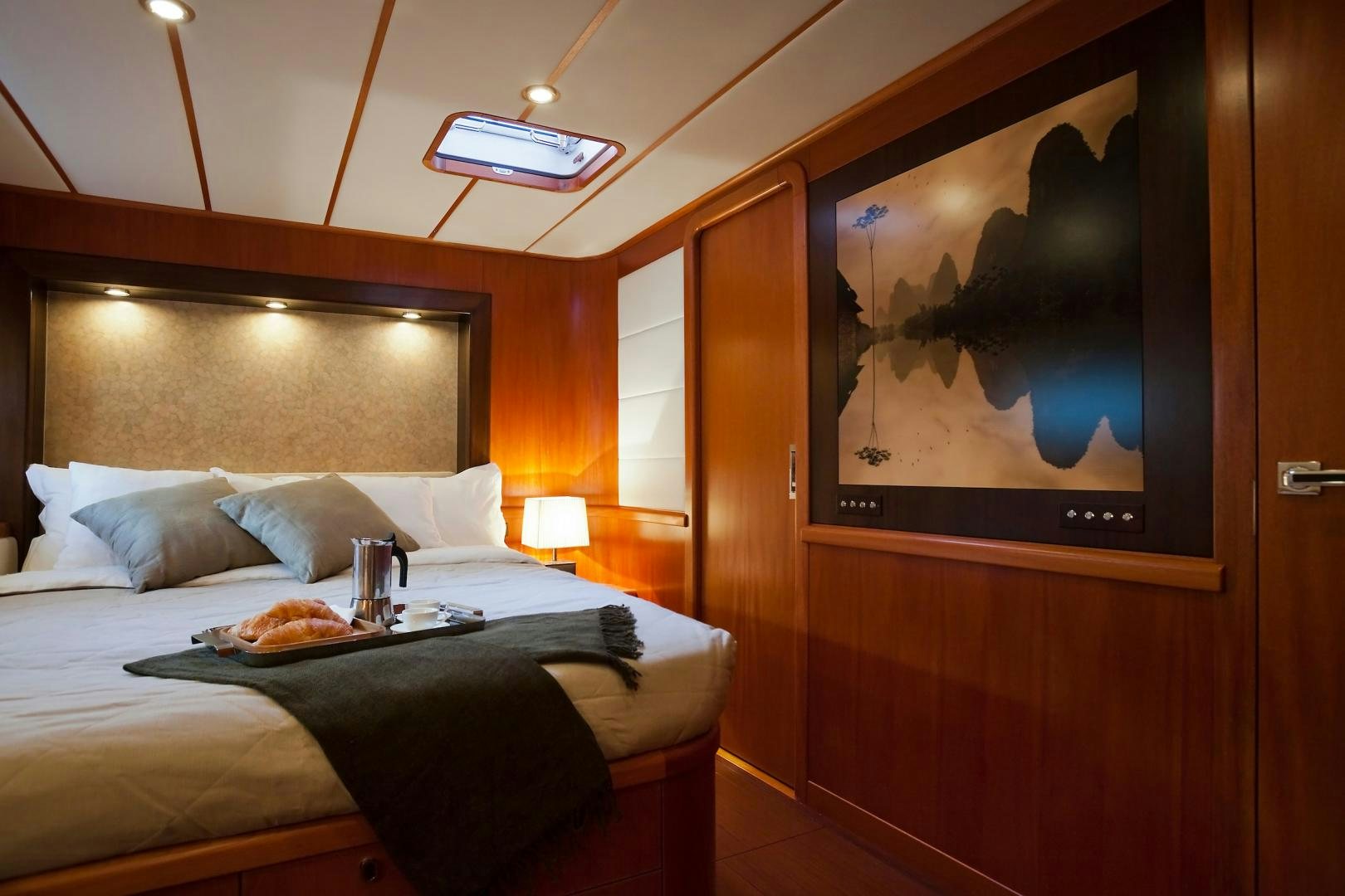 a bed with a tray on it aboard CHILD OF LIR  Yacht for Sale