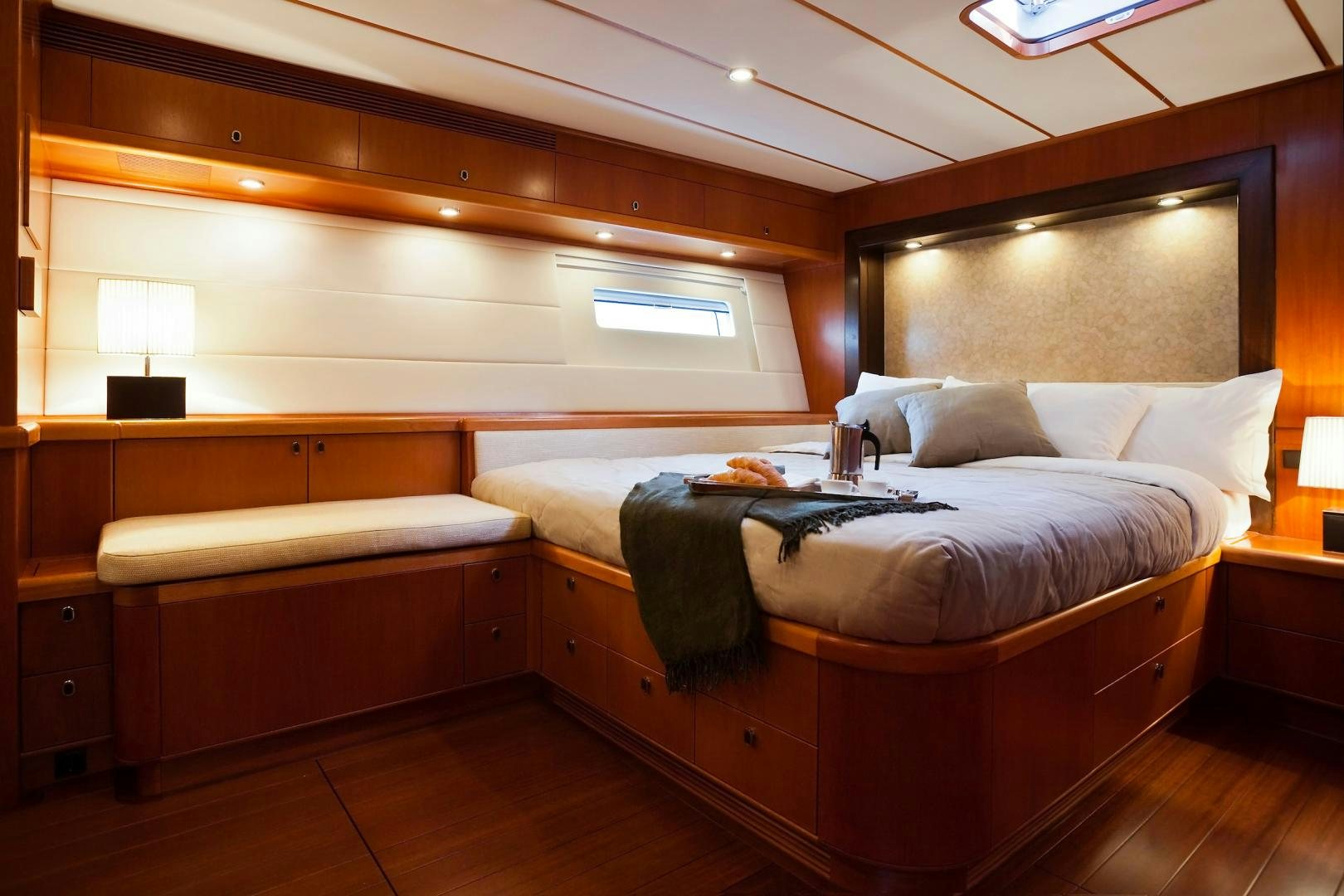 a room with a bed and a desk aboard CHILD OF LIR  Yacht for Sale