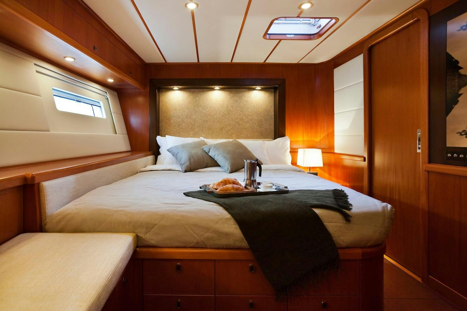 a bed with a tray on it aboard CHILD OF LIR  Yacht for Sale