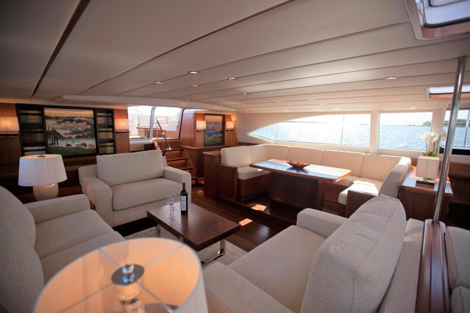 a living room with a large window aboard CHILD OF LIR  Yacht for Sale
