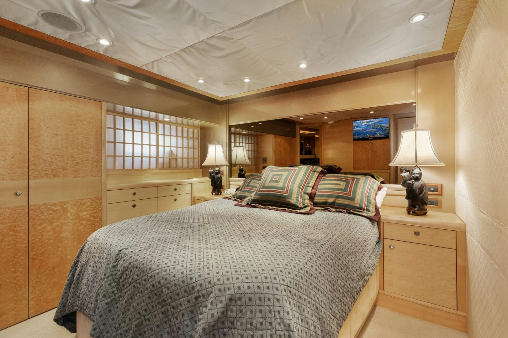 a bedroom with a bed and a desk aboard ILLEAGLE Yacht for Sale
