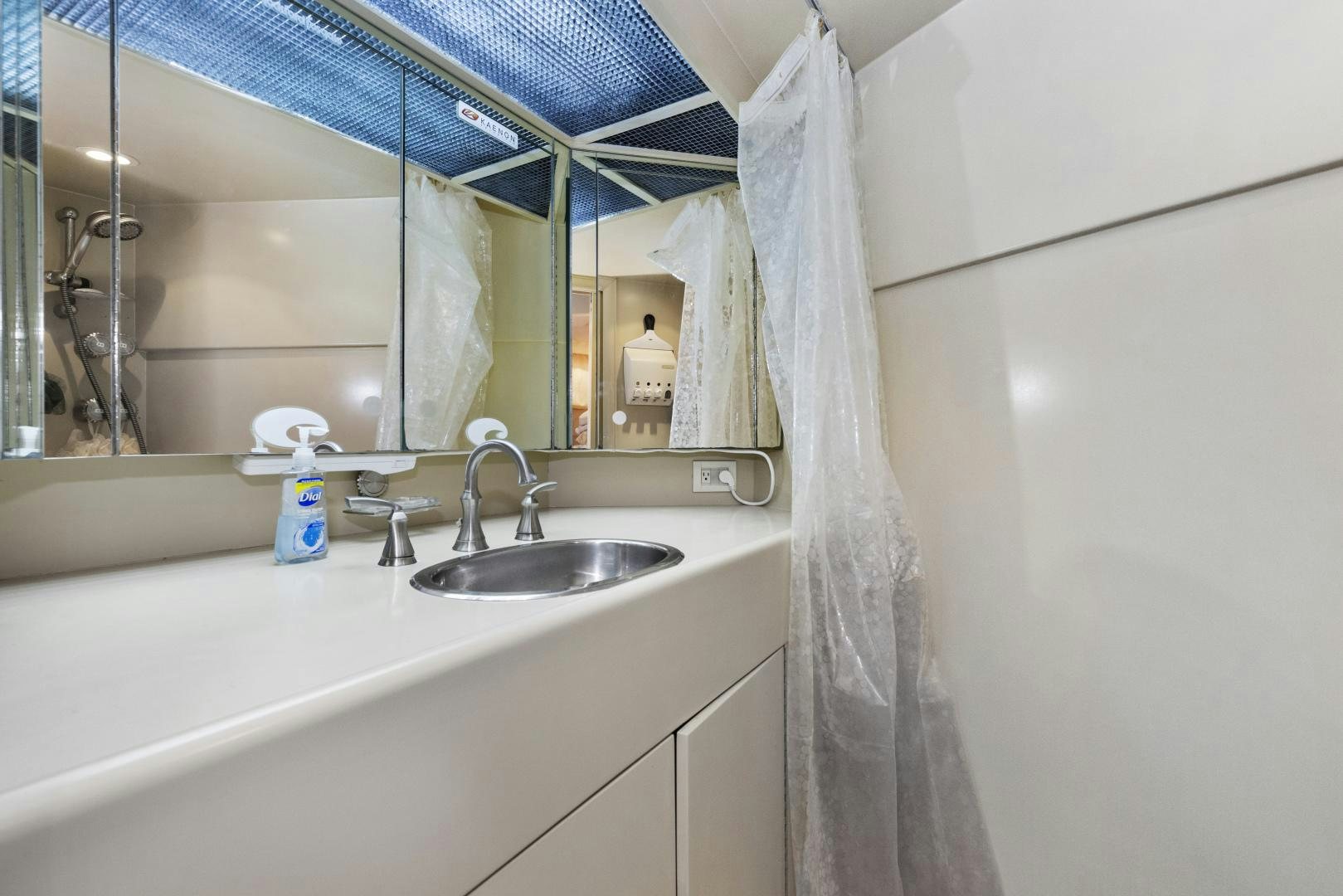 a bathroom with a sink and a mirror aboard ILLEAGLE Yacht for Sale