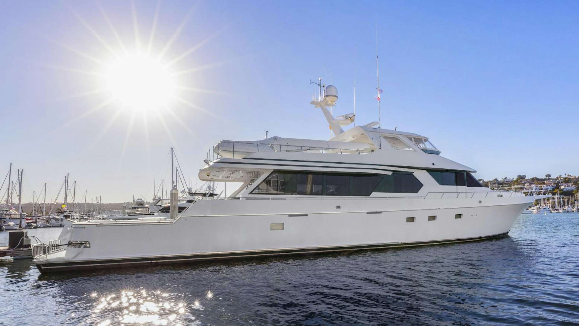 a white yacht on the water aboard AMERICAN MADE Yacht for Sale
