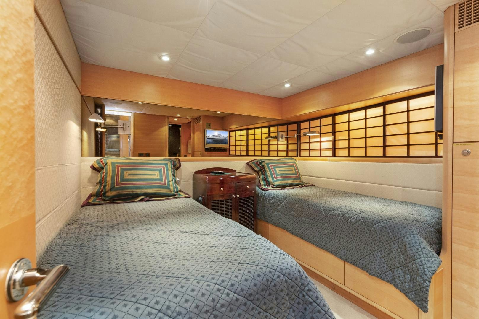 a room with a bed and a desk aboard ILLEAGLE Yacht for Sale