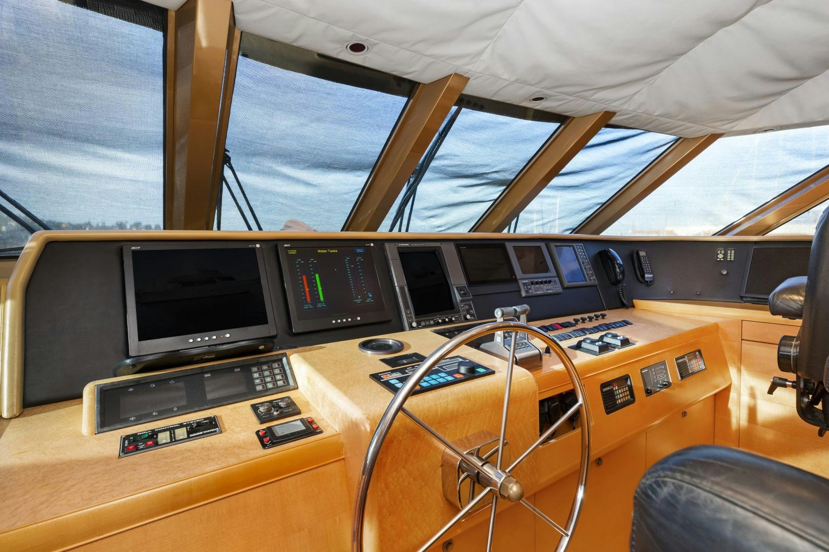 a boat with a few monitors and a couple of screens aboard ILLEAGLE Yacht for Sale