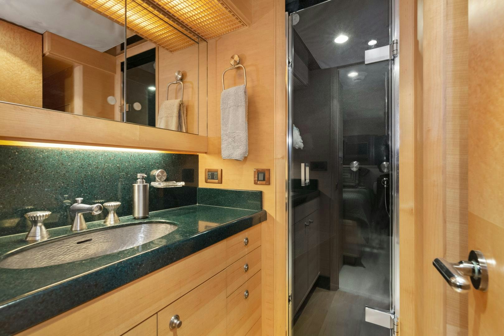a bathroom with a large mirror aboard ILLEAGLE Yacht for Sale