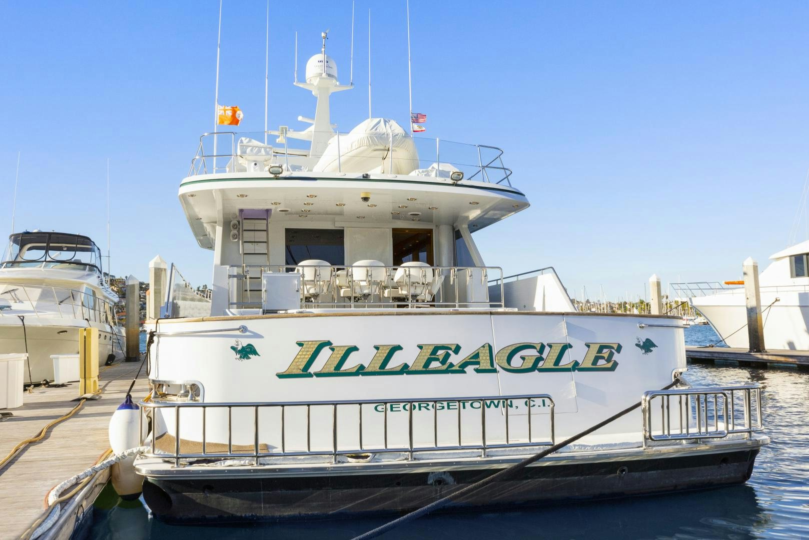 a large white boat docked aboard ILLEAGLE Yacht for Sale