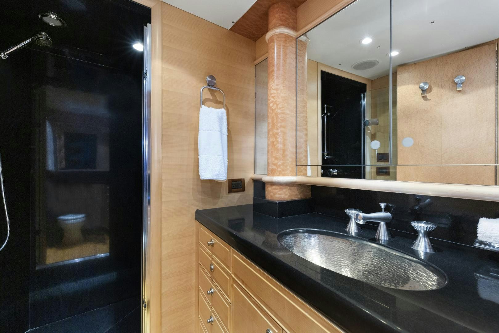 a bathroom with a sink and a mirror aboard ILLEAGLE Yacht for Sale
