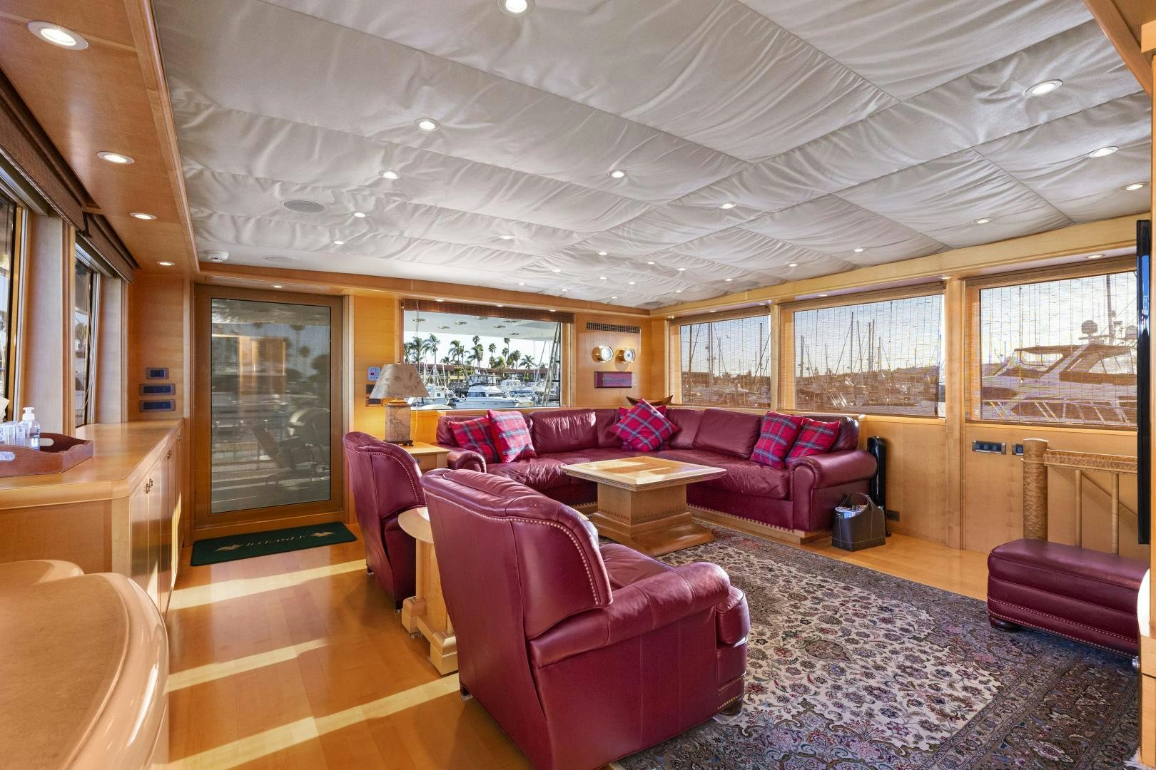 a living room with a large window aboard ILLEAGLE Yacht for Sale