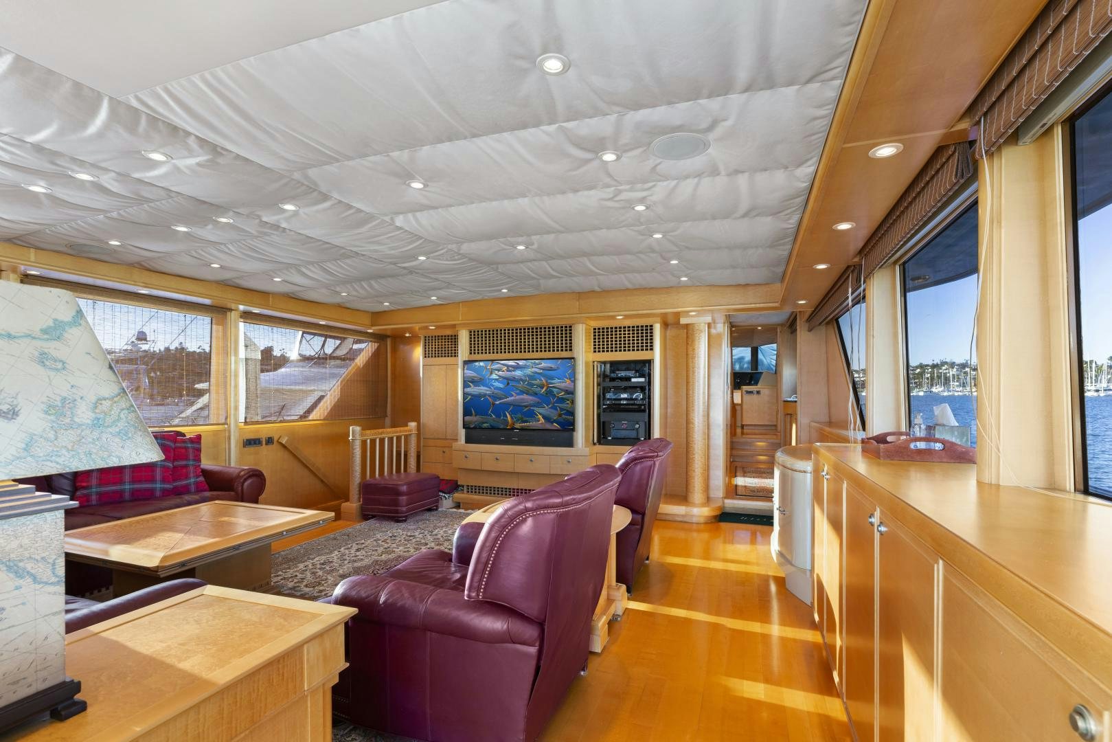 a living room with a wood floor aboard ILLEAGLE Yacht for Sale