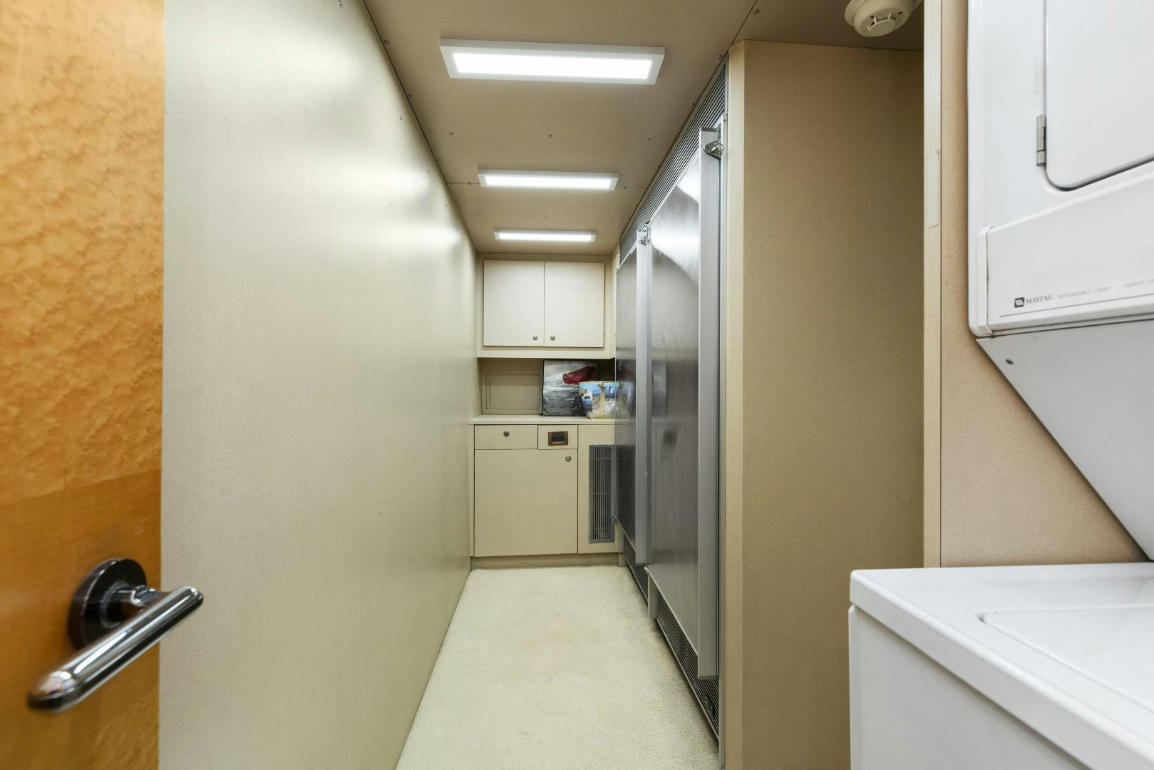 a hallway with white cabinets aboard ILLEAGLE Yacht for Sale