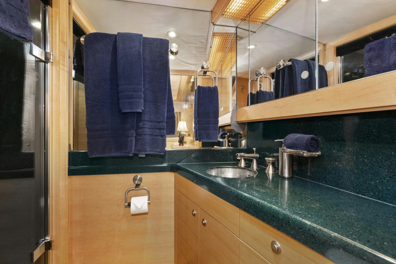 a bathroom with a sink and towels aboard ILLEAGLE Yacht for Sale