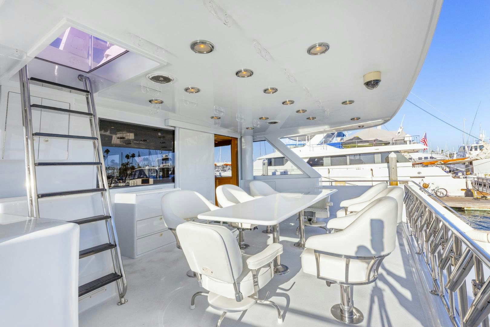 a room with chairs and tables aboard ILLEAGLE Yacht for Sale