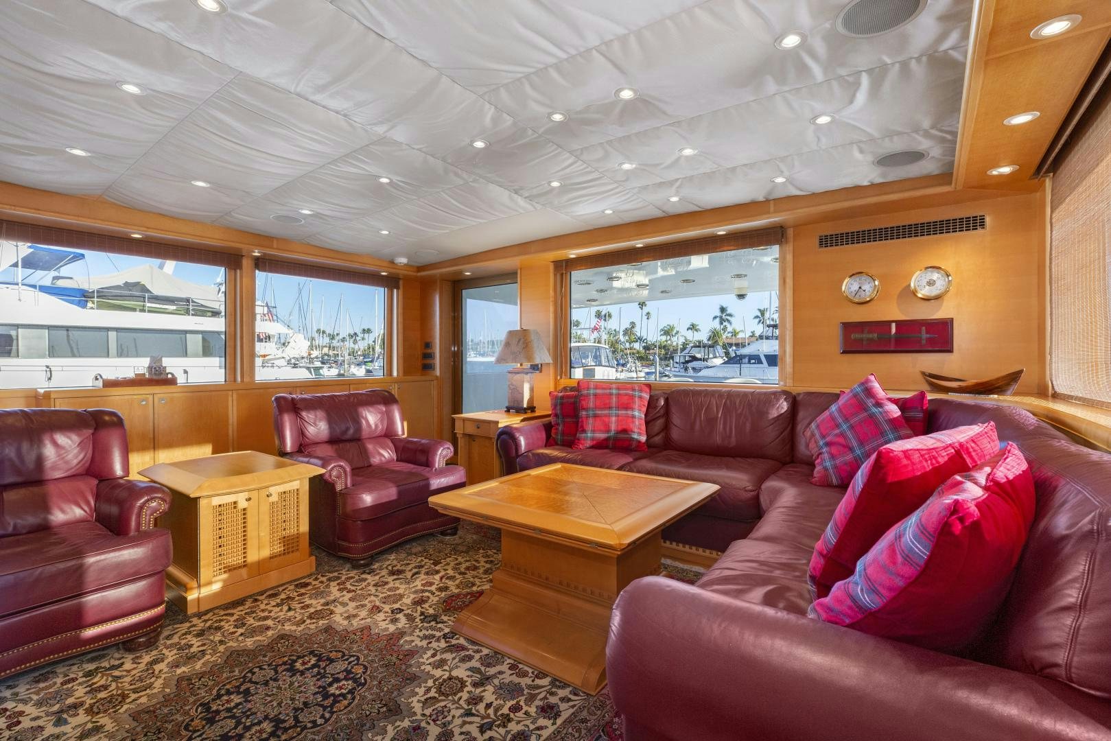 a living room with leather couches aboard ILLEAGLE Yacht for Sale