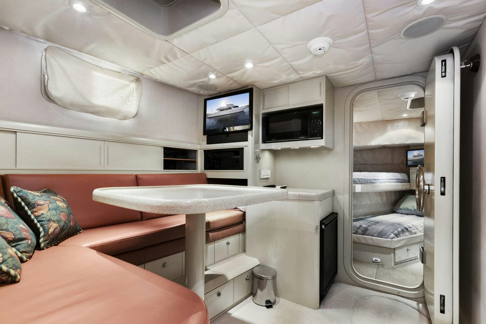 a room with a bed and a desk aboard ILLEAGLE Yacht for Sale