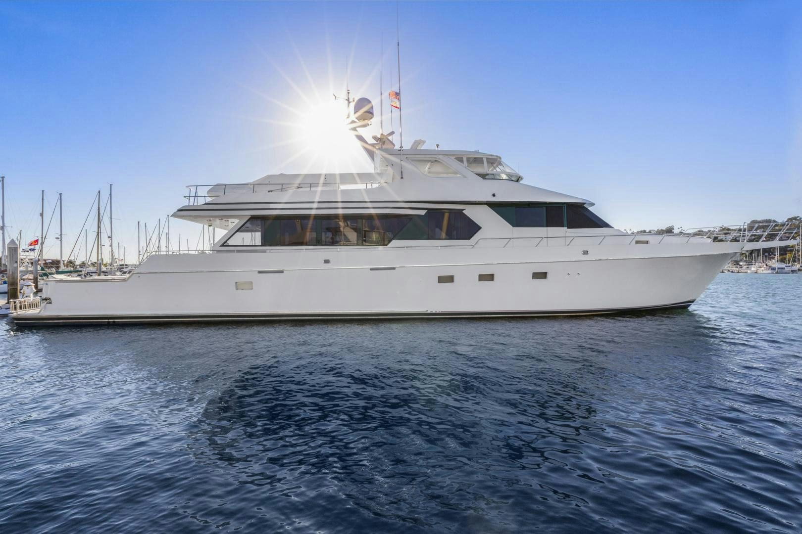 a large white yacht on the water aboard ILLEAGLE Yacht for Sale