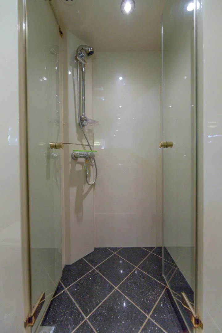 a shower with a glass door aboard MR. CAT Yacht for Sale