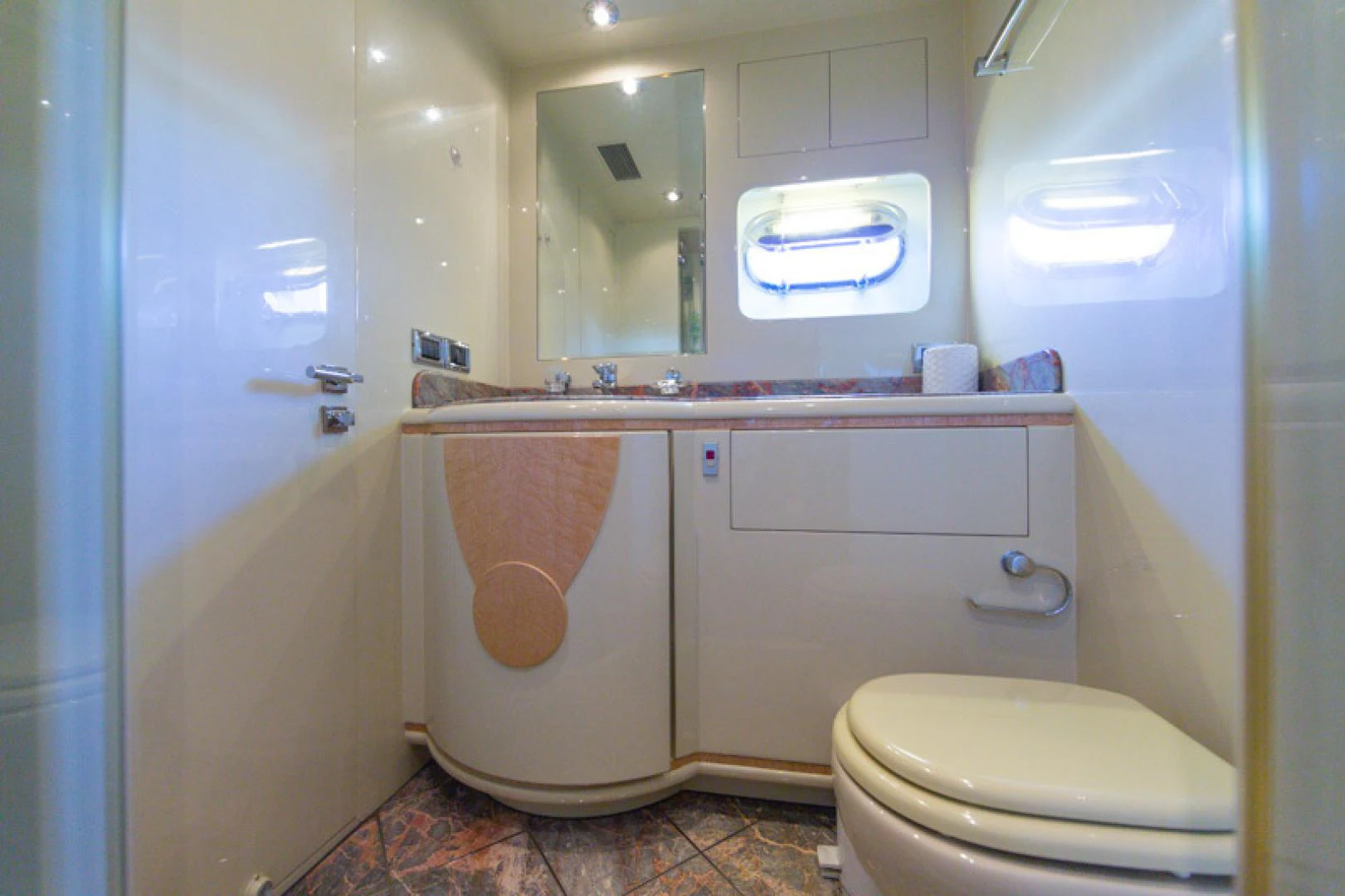 a bathroom with a toilet and a sink aboard MR. CAT Yacht for Sale