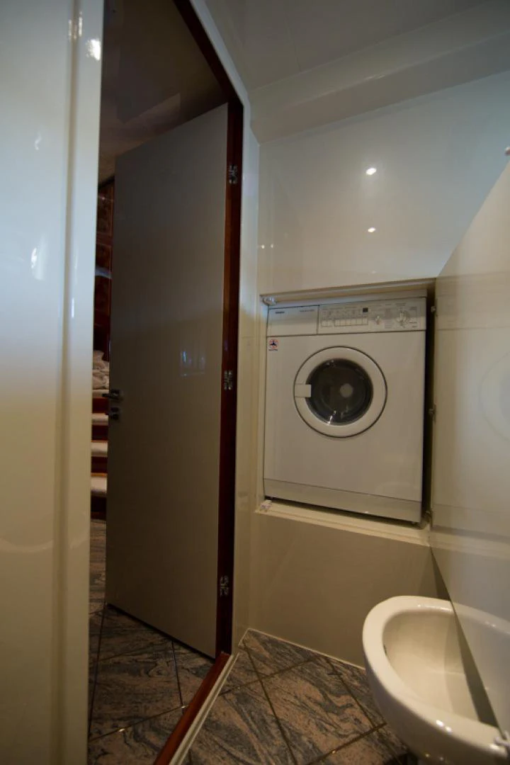 a washer and dryer in a bathroom aboard MR. CAT Yacht for Sale