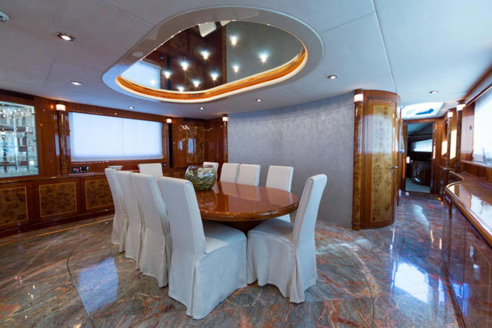 a dining room with a table and chairs aboard MR. CAT Yacht for Sale